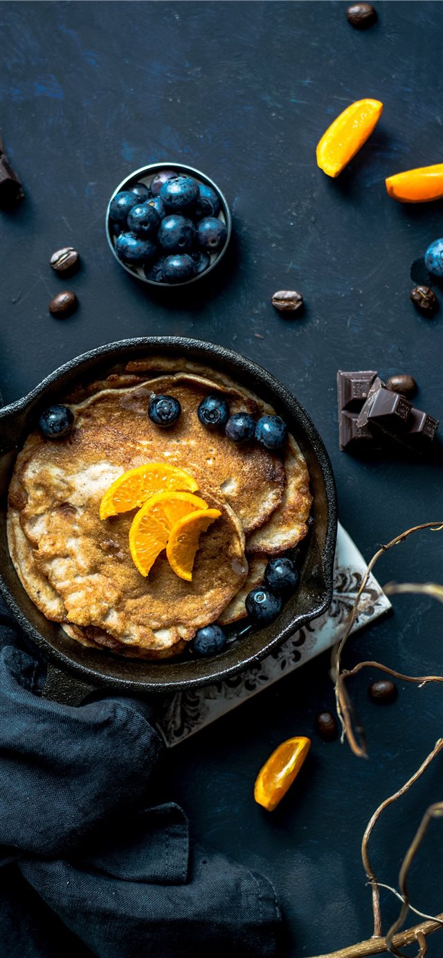 1125x2436 Pancakes with orange and blueberries - eating iPhone X Wallpaper