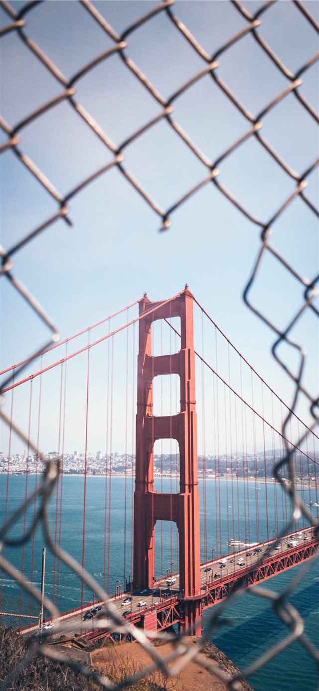 1125x2436 Through the Fence - urban iPhone X Wallpaper