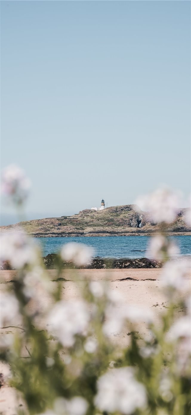 1125x2436 Lighthouseinthesky - bokeh iPhone X Wallpaper