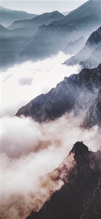 Sun---fog---mountains iPhone X wallpaper
