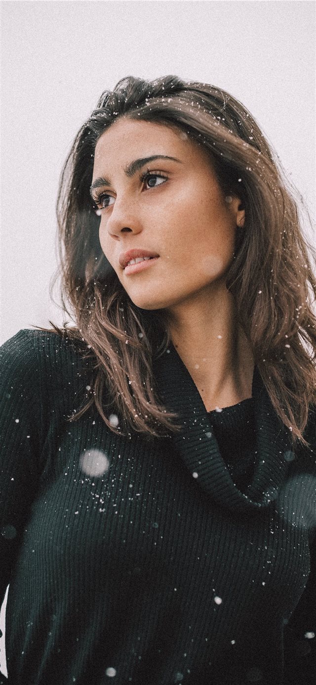 1125x2436 woman wearing black long sleeved shirt on snow fie... -  iPhone X Wallpaper