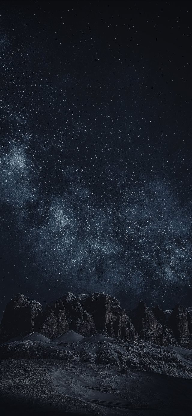 1125x2436 black rock formation during night time - night iPhone X Wallpaper