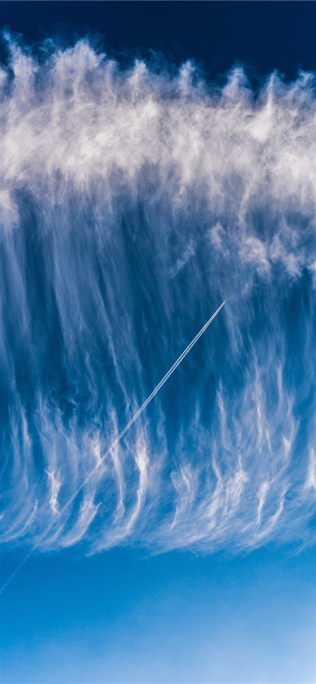 1125x2436 Sky surfing   Airplane skytrail (contrail) in a wa... - aerial view iPhone X Wallpaper
