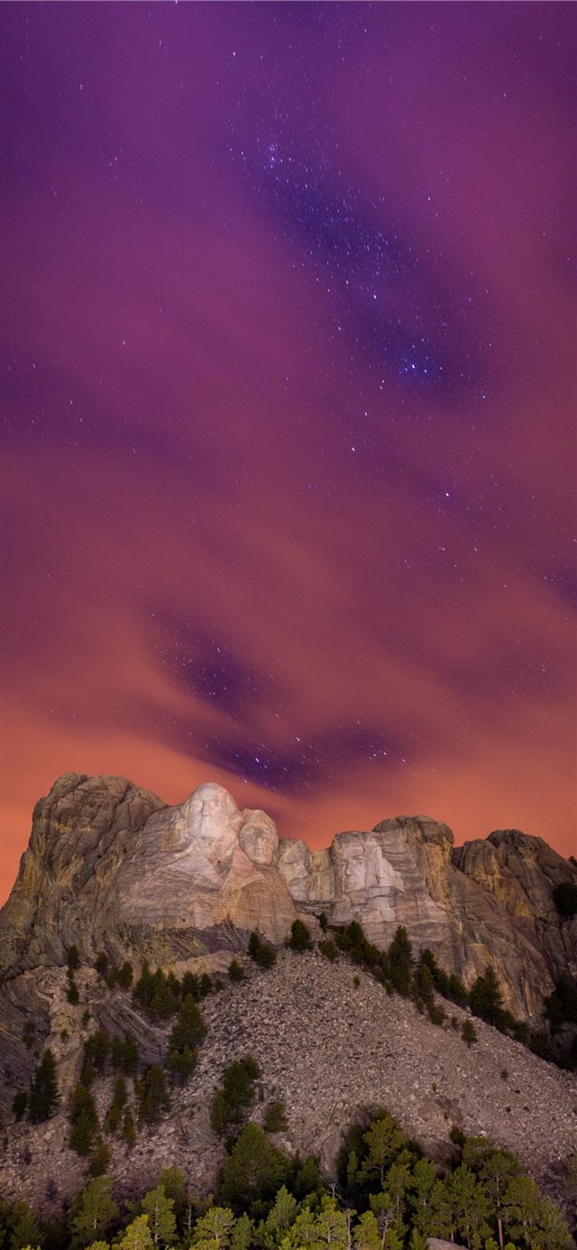 1125x2436 The Stars peak through the clouds at Mount Rushmor... - starry night iPhone X Wallpaper