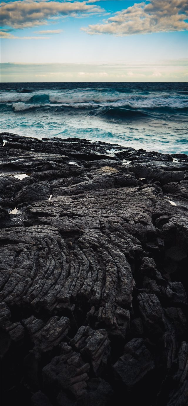 1125x2436 Dusk over a field of lava bordering the Pacific Oc... - lava iPhone X Wallpaper