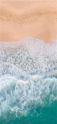 aerial photography of waves splashing on white san... wallpaper