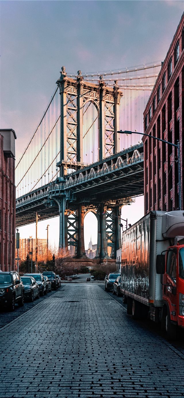 1125x2436 cars parked on both sides of street near bridge - red iPhone X Wallpaper