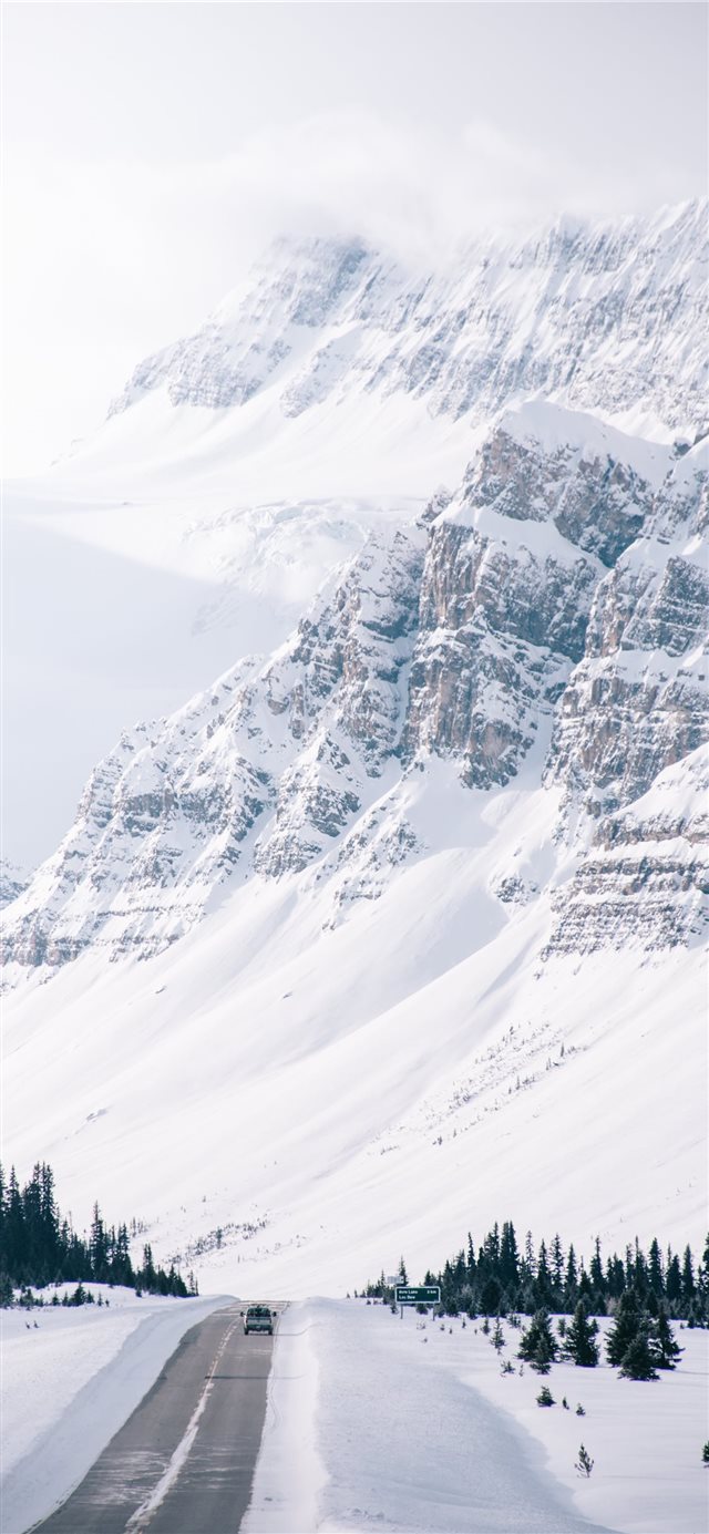 1125x2436 white snow covered hills and road side - snow iPhone X Wallpaper