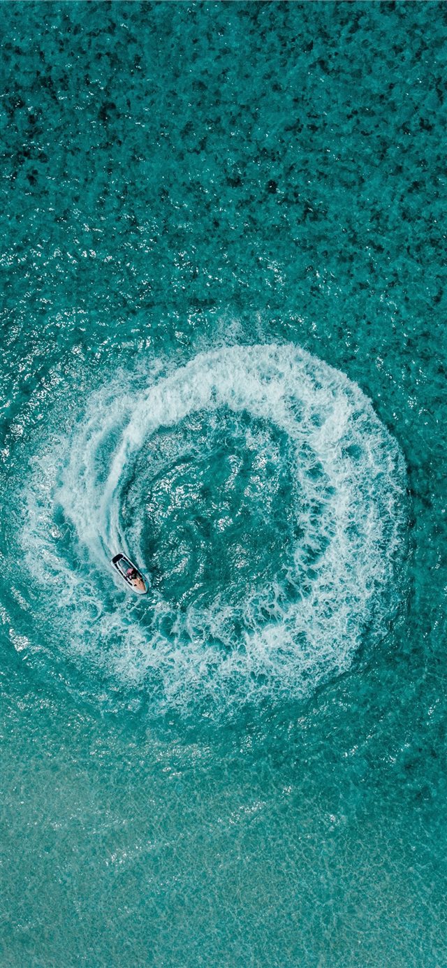 1125x2436 aerial shot person riding on personal watercraft - scenery iPhone X Wallpaper