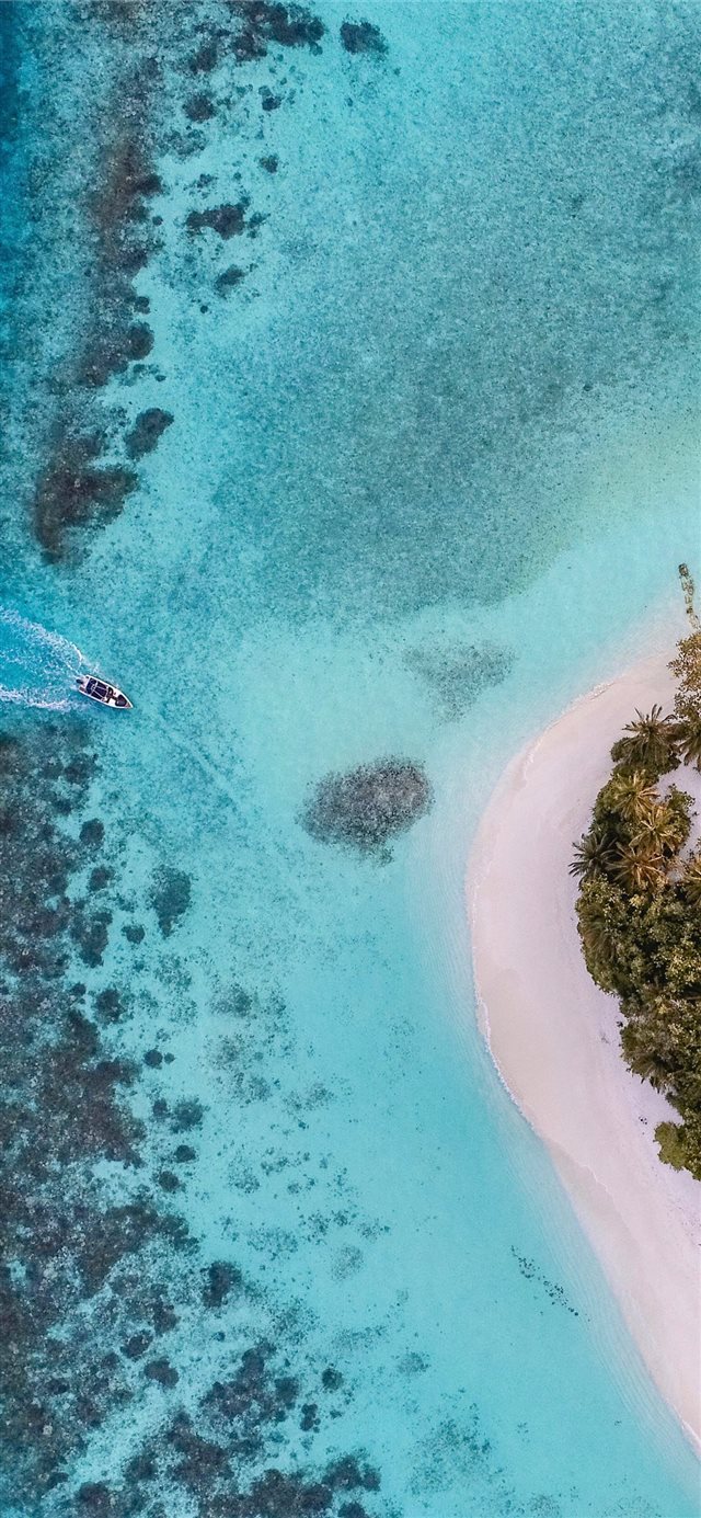 1125x2436 aerial photo of boat moving towards the white isla... - maldives iPhone X Wallpaper