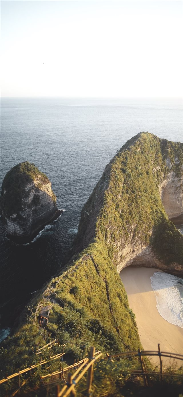 1125x2436 land formation near body of water during daytime - scenery iPhone X Wallpaper