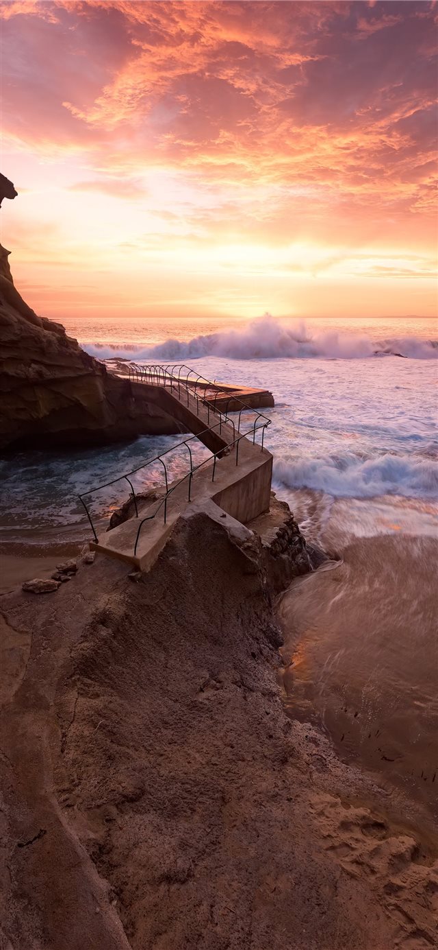 1125x2436 waves crashing on rocky coast during sunset - sunset iPhone X Wallpaper