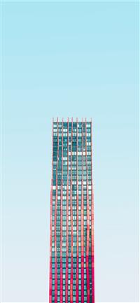 high rise building under blue skies daytime wallpaper