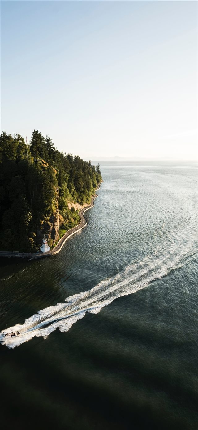 1125x2436 white speedboat passing on sea under clear blue sk... - vancouver iPhone X Wallpaper