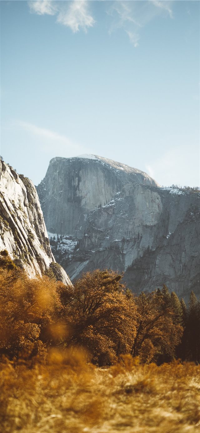 1125x2436 gray concrete mountain during daytime - scenery iPhone X Wallpaper
