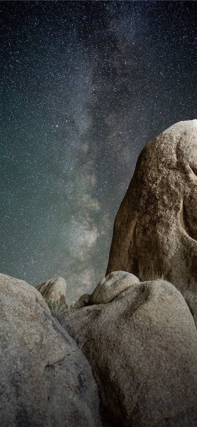 1125x2436 brown rock formations under starry night - light iPhone X Wallpaper