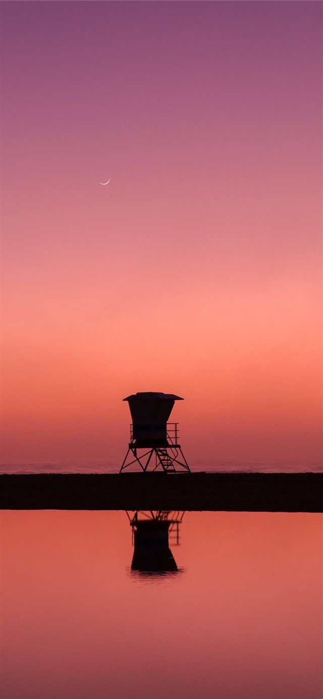1125x2436 silhouette photo of lifeguard house - pink iPhone X Wallpaper