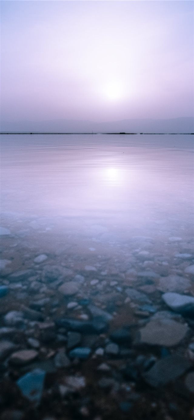 1125x2436 stones and body of watr - sun iPhone X Wallpaper