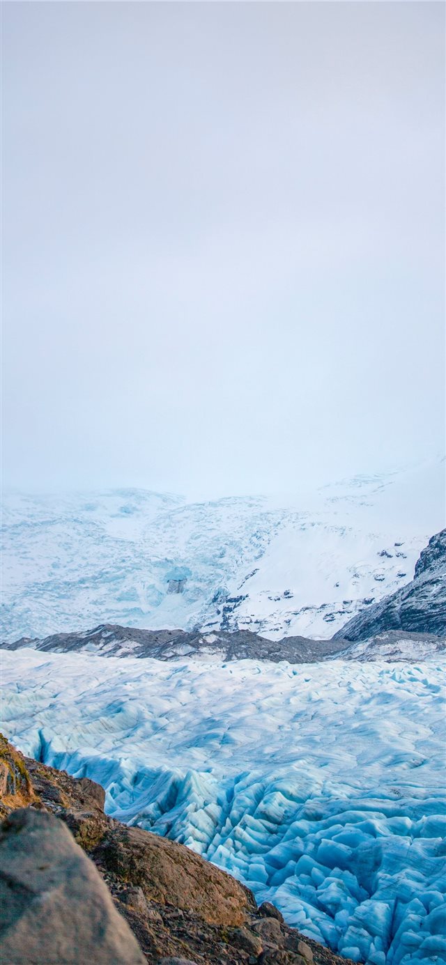 1125x2436 white mountains during daytime - snow iPhone X Wallpaper