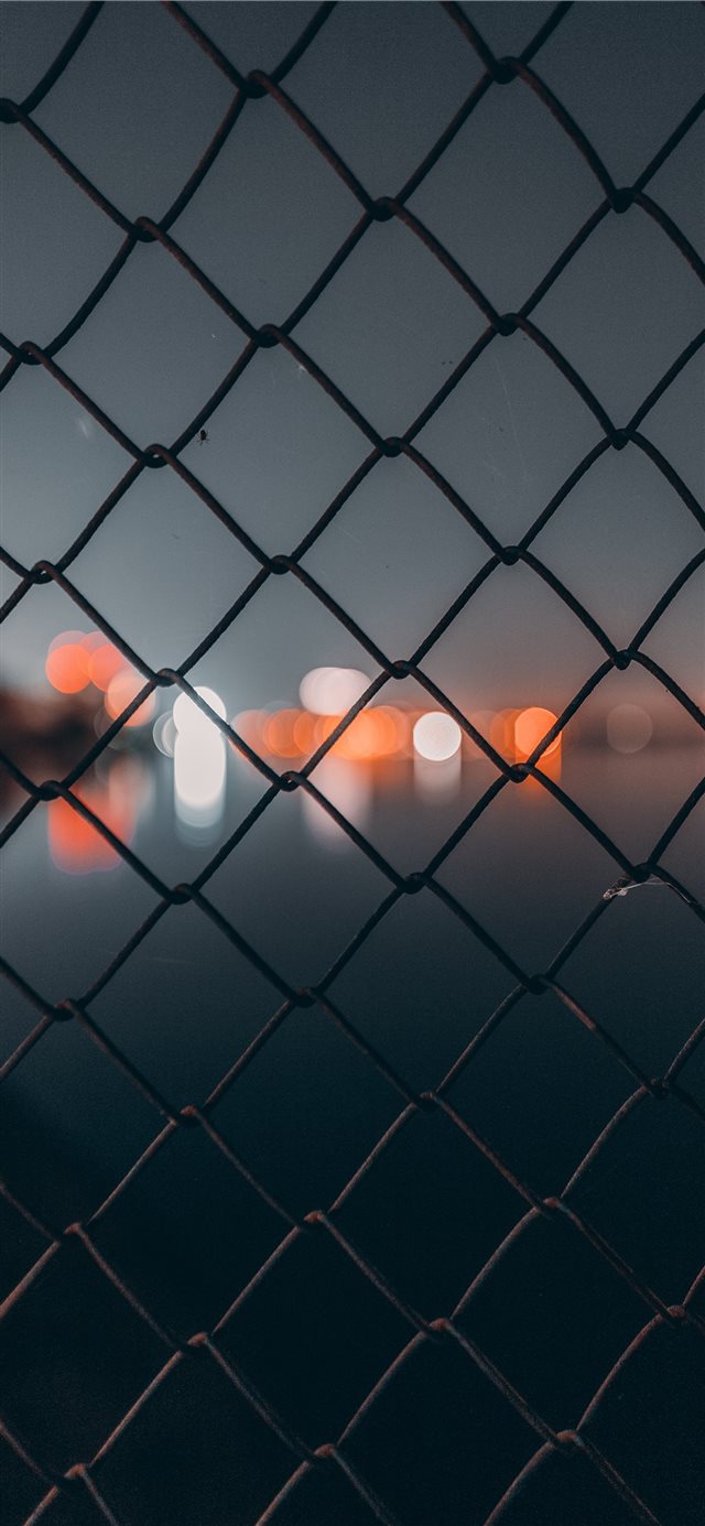 1125x2436 chain link fence behind bokeh - grey iPhone X Wallpaper