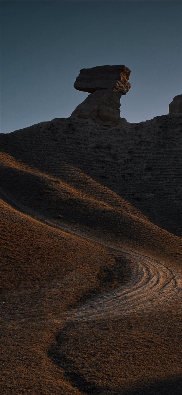 1125x2436 road leading to rock foormation - light iPhone X Wallpaper