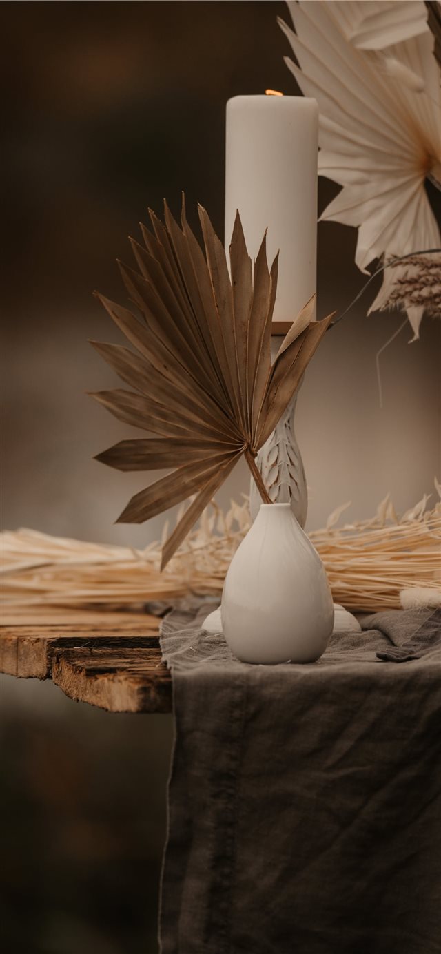 1125x2436 white pillar candle on candle holder - wood iPhone X Wallpaper