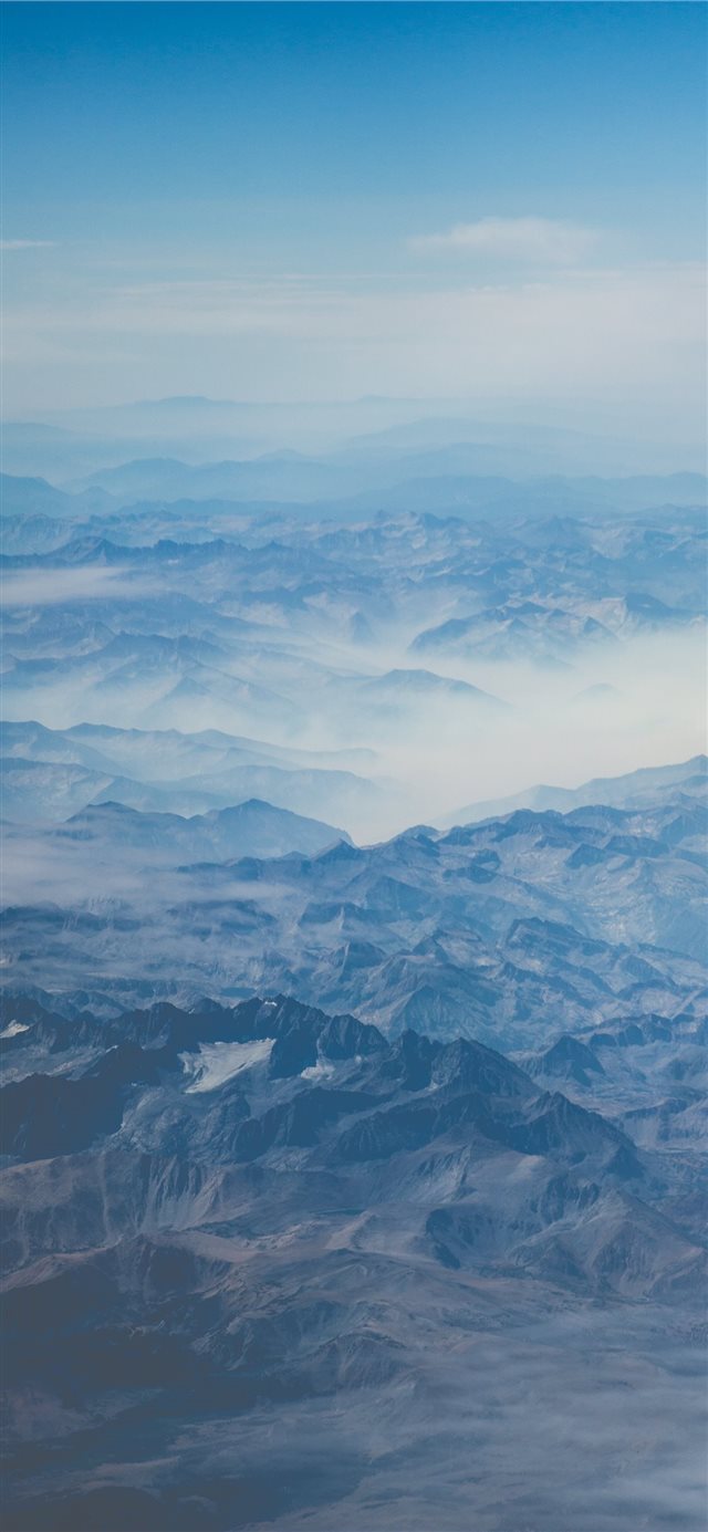 1125x2436 mountain under blue sky at daytime - clouds iPhone X Wallpaper