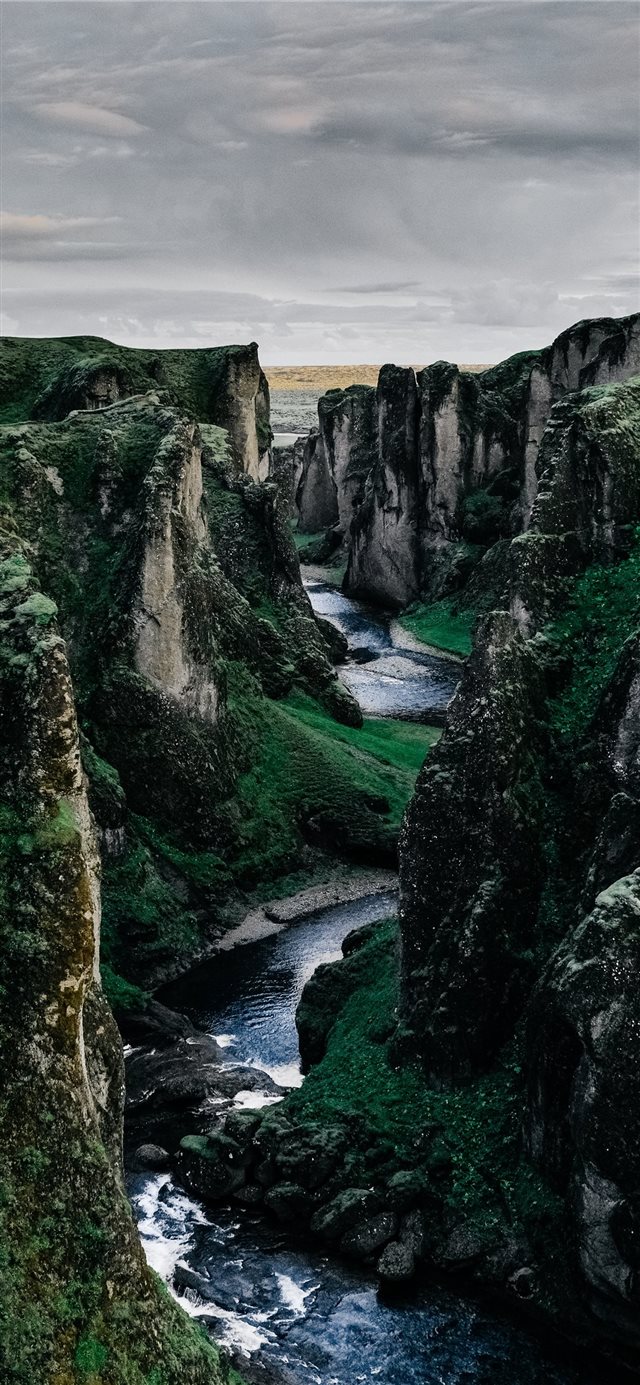 1125x2436 river surrounded by rock formation - iceland iPhone X Wallpaper