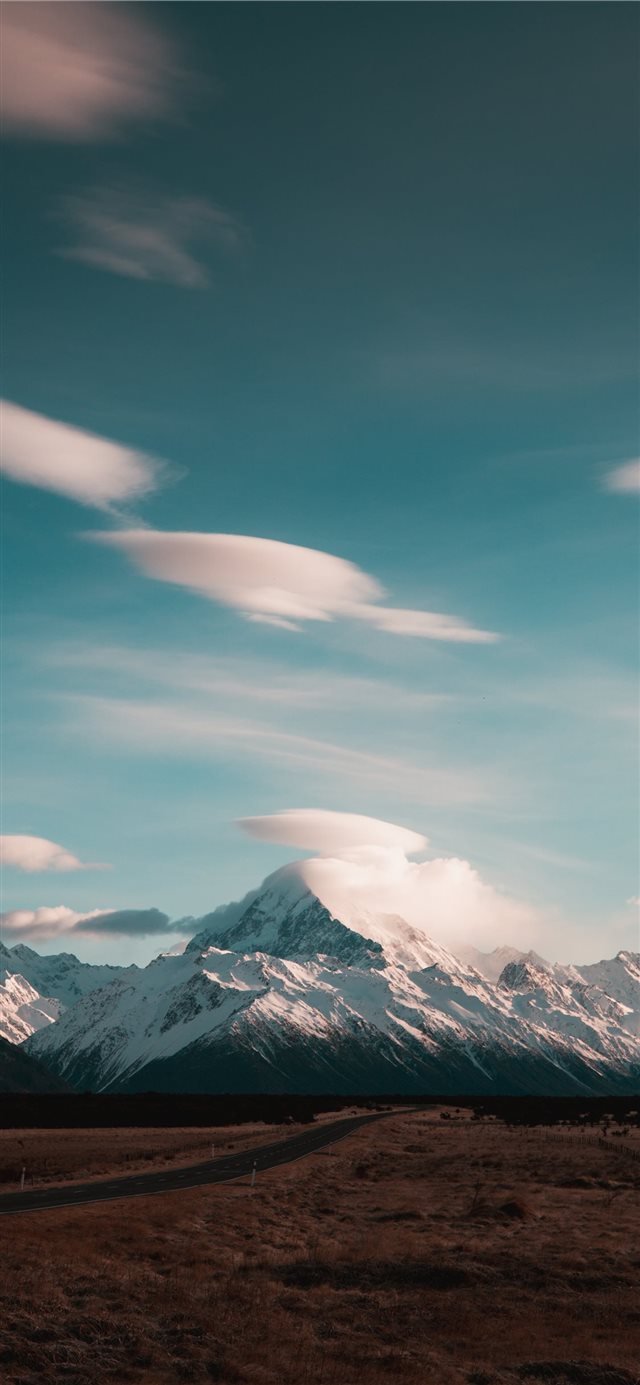 1125x2436 white mountain during daytime - snow iPhone X Wallpaper