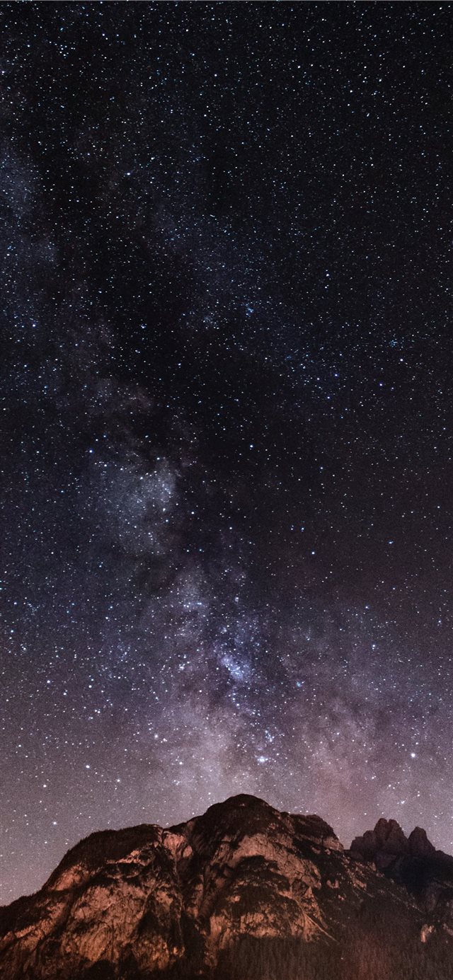 1125x2436 brown and black mountain during starry night - grey iPhone X Wallpaper