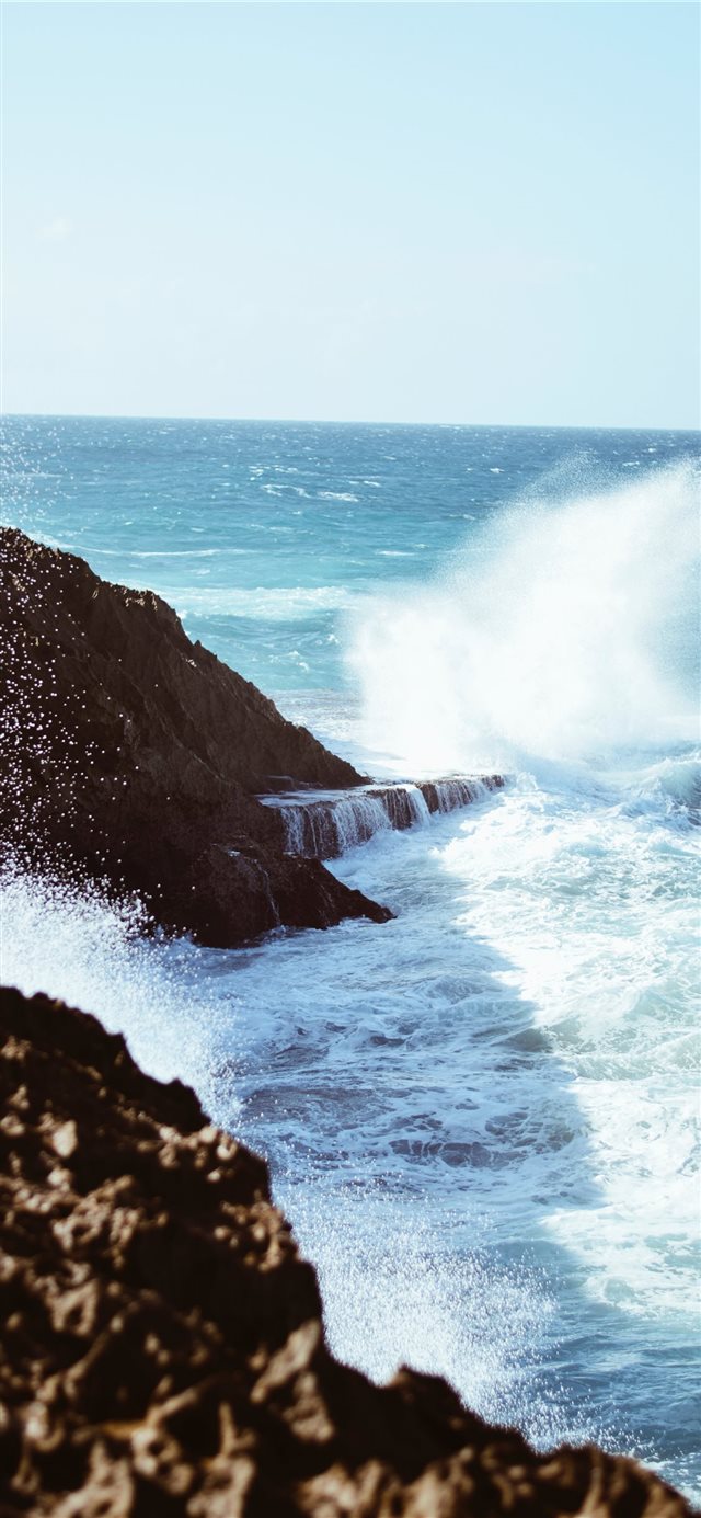 1125x2436 aerial view photography of rocky shore - water iPhone X Wallpaper