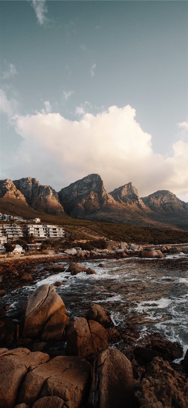 1125x2436 overlooking building nearby mountain - grey iPhone X Wallpaper