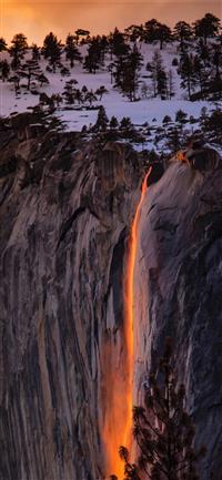 waterfalls near cliff at golden hour wallpaper