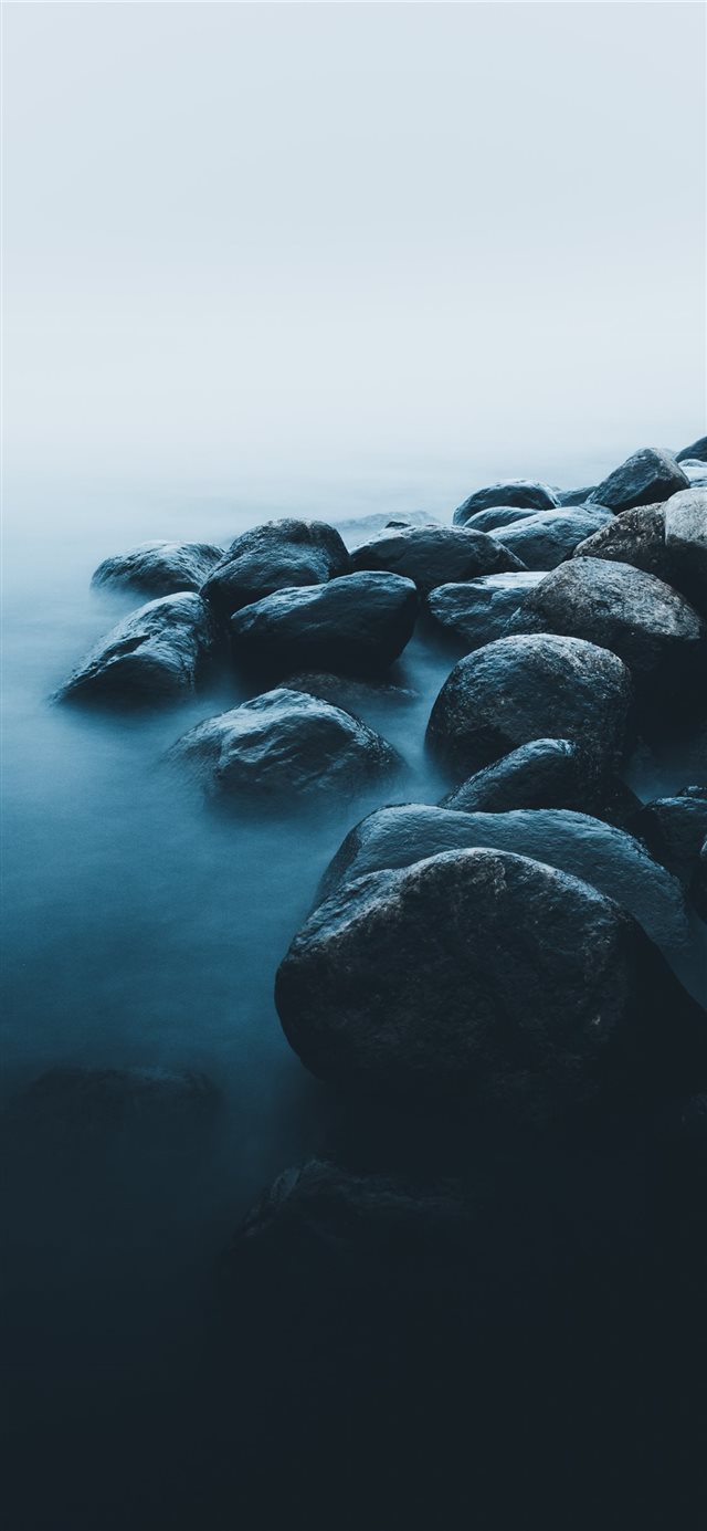 1125x2436 rocks near body of water - nature iPhone X Wallpaper