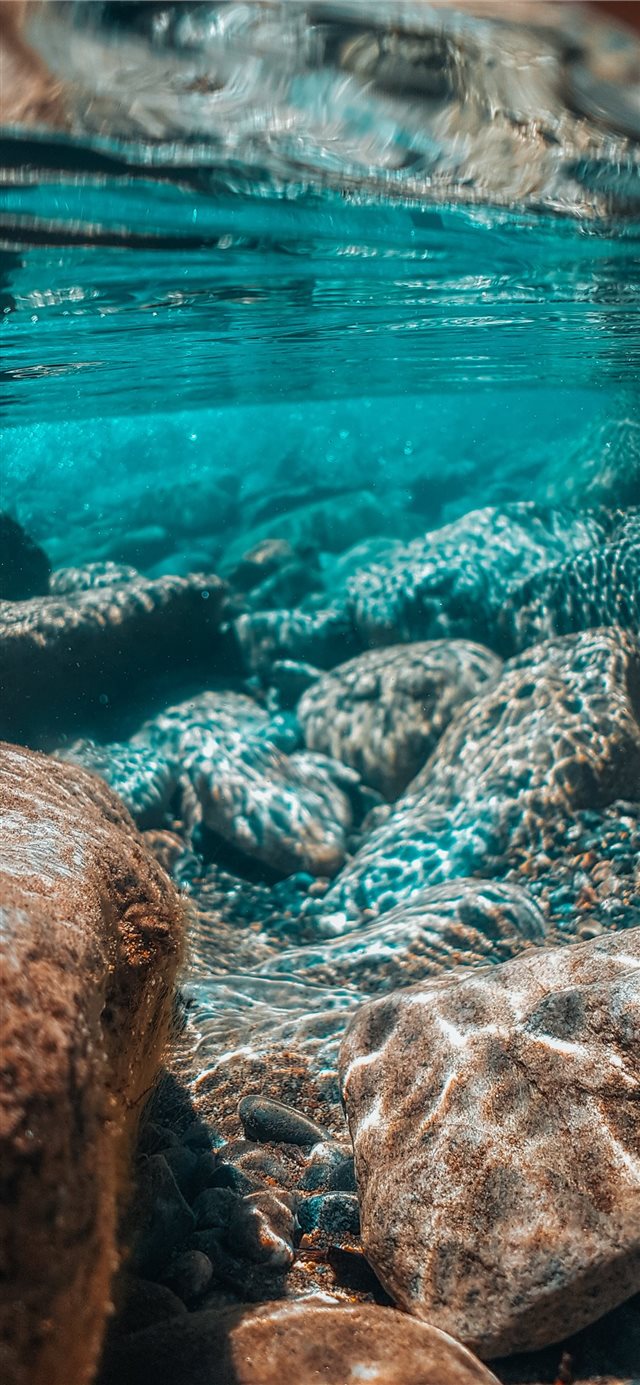 1125x2436 underwater photography of brown stones - blue iPhone X Wallpaper