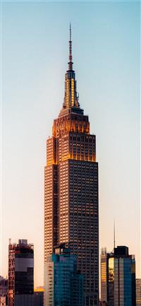 brown and black high rise building wallpaper