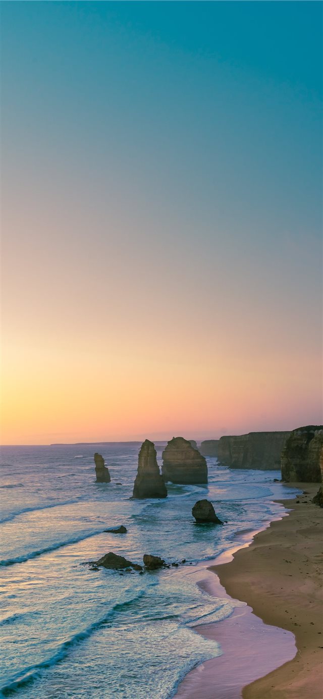 1125x2436 rock formations on body of water - australia iPhone X Wallpaper