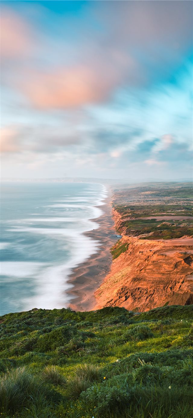 1125x2436 brown and green mountain beside body of water duri... - landscape iPhone X Wallpaper