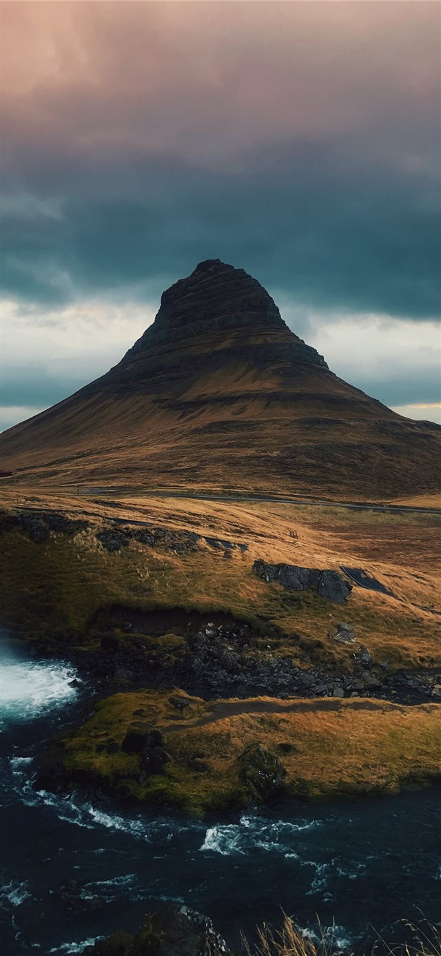 1125x2436 mountain near water coast under cloudy sky - light iPhone X Wallpaper