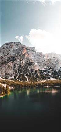 lake near mountain under blue sky during daytime wallpaper