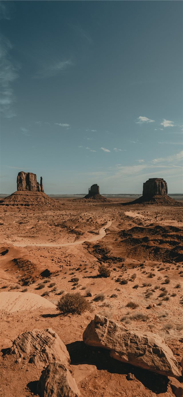 1125x2436 brown rock formation under white clouds during day... -  iPhone X Wallpaper
