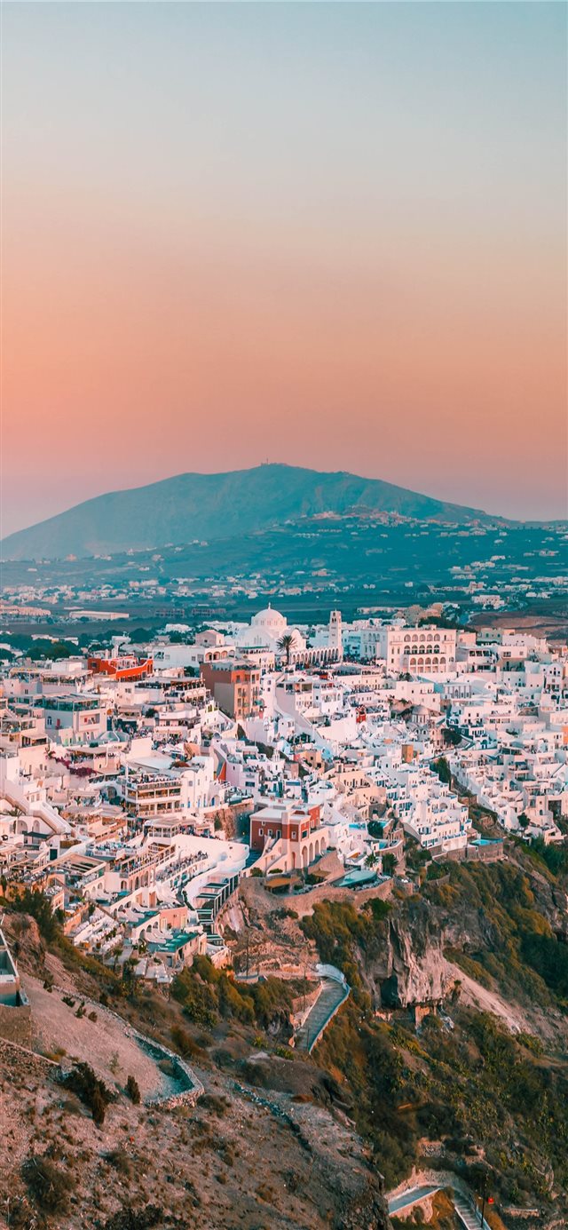 1125x2436 city buildings on mountain during daytime - landscape iPhone X Wallpaper
