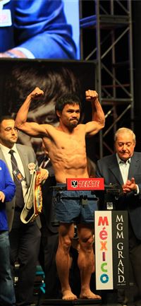 Manny Pacquiao standing on weighing scale free ima... wallpaper