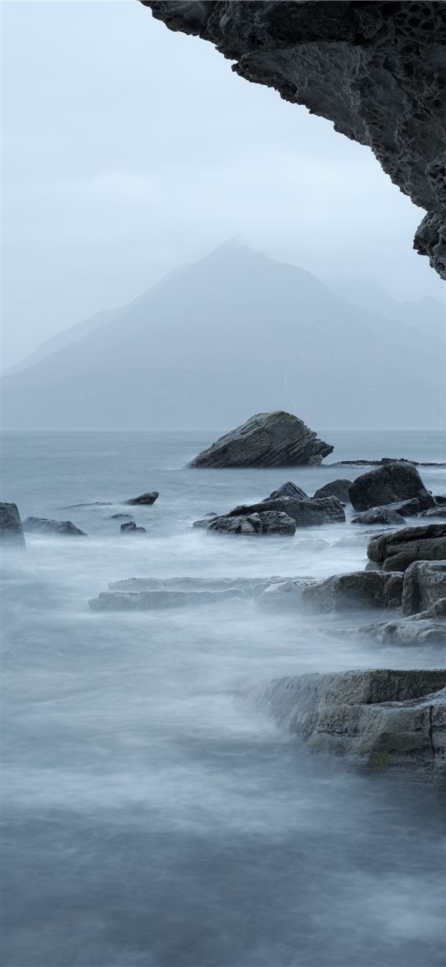 1125x2436 rocky mountain beside body of water during daytime - bird iPhone X Wallpaper