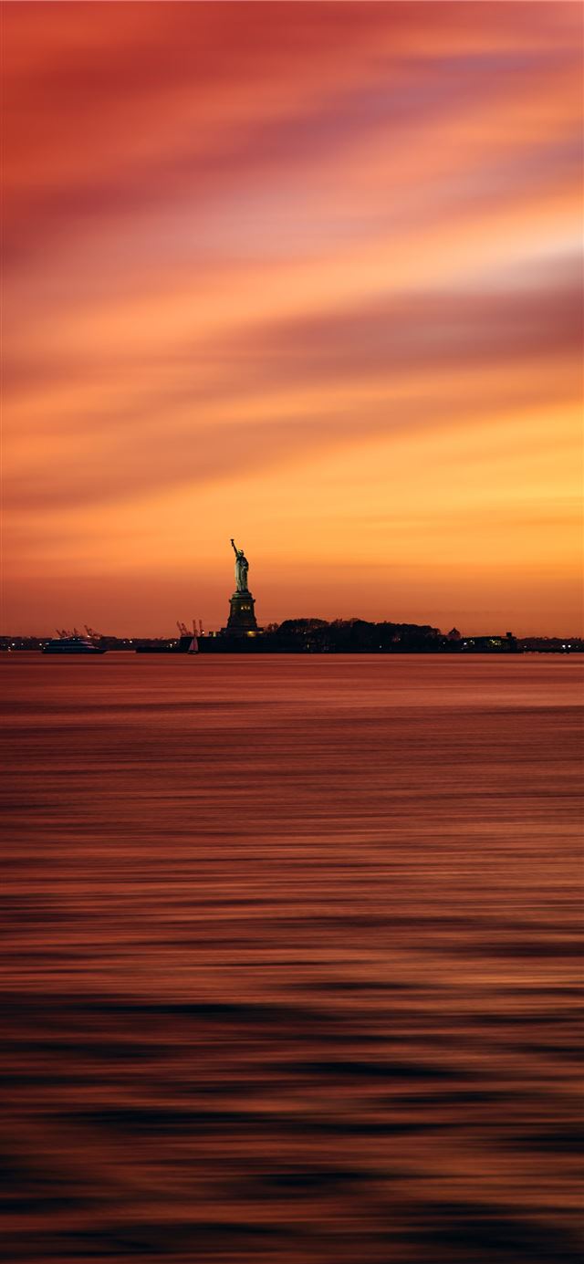 1125x2436 silhouette of man standing on rock formation near ... - ny iPhone X Wallpaper