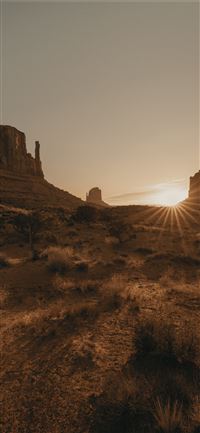 brown rock formation under white sky during daytim... wallpaper