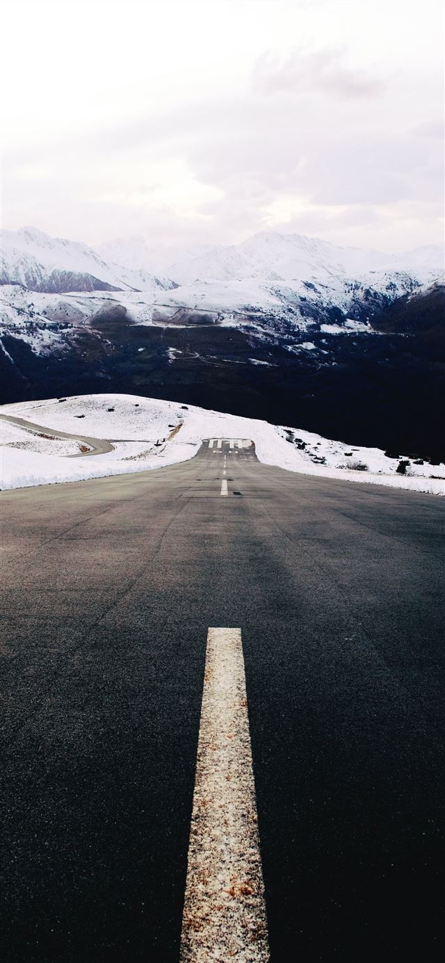 1125x2436 gray concrete road near snow covered mountain duri... - snow iPhone X Wallpaper