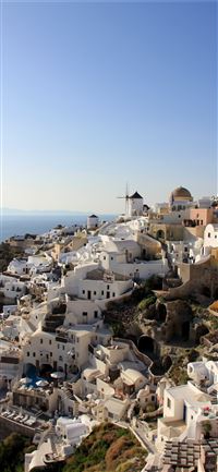 white painted mediterranean houses on a slope on s... wallpaper