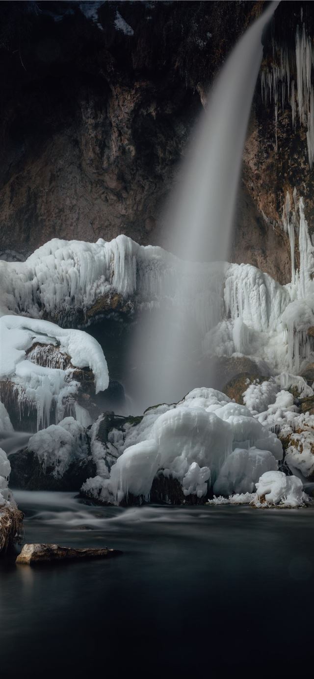 1125x2436 water falls in the middle of brown rocky mountain - mountain iPhone X Wallpaper