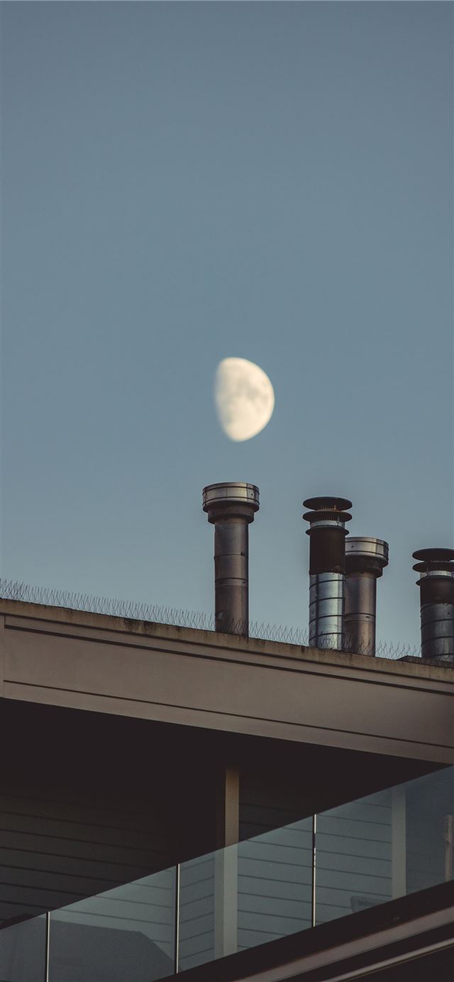 1125x2436 view of the moon on the sky and chimneys - grey iPhone X Wallpaper
